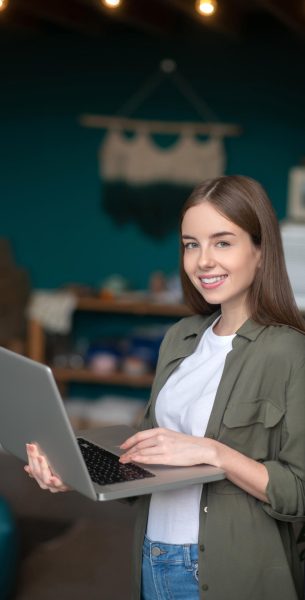 young-confident-woman-using-her-laptop-for-texting-2024-10-18-06-46-01-utc.jpg